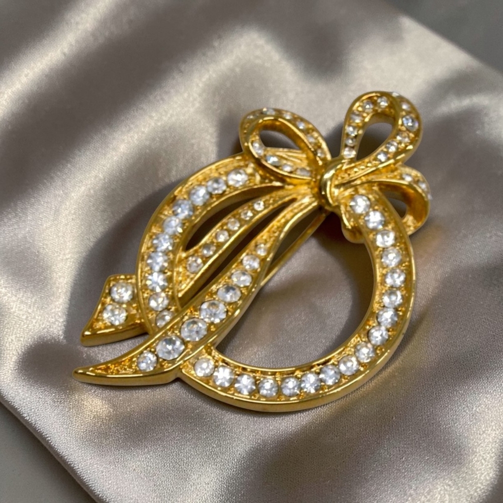 Vintage Nolan Miller Gold Bow and Crystal Circle Brooch